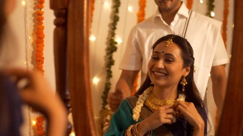 Reflection of South Indian couple in the mirror - smiling and getting ready Video stock 112769416