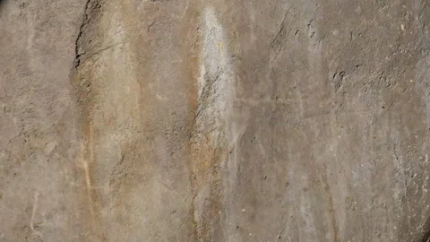 Reflection of sparkling ripples of water on the surface of the rock Stock Footage 319808765
