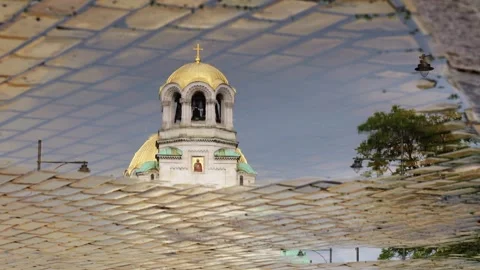 Reflection of St. Alexander Nevsky Cathedral in Rain Puddle, 2025 Stock Footage 322117039