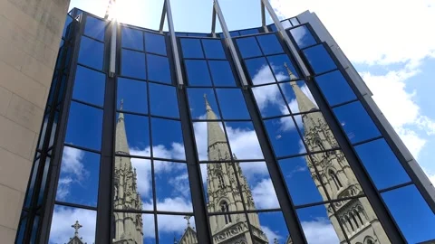 Reflection of St. Paul Cathedral and blue sky in the glass wall of the Univ.. Stock Footage 324549776