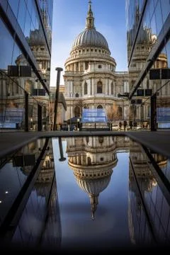 Reflection of St Paul's Cathedral in vertical and horizontal planes against a Stock Photos