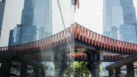 Reflection of the sudirman pedestrian bridge Stock Photos