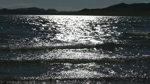 The reflection of the sun and the waves, slow motion. Stock Footage 79130717