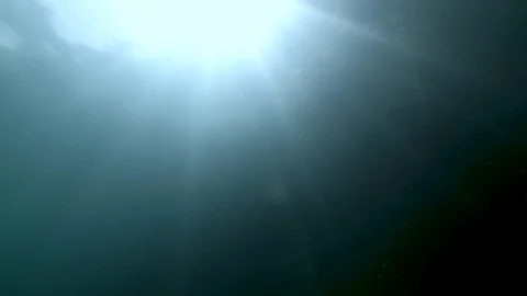 Reflection of the sun from beneath the surface of the water, Albano lake, Italy Stock Footage 107571870