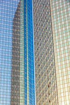 Reflection of the sun in the facade of a skyscraper Stock Photos
