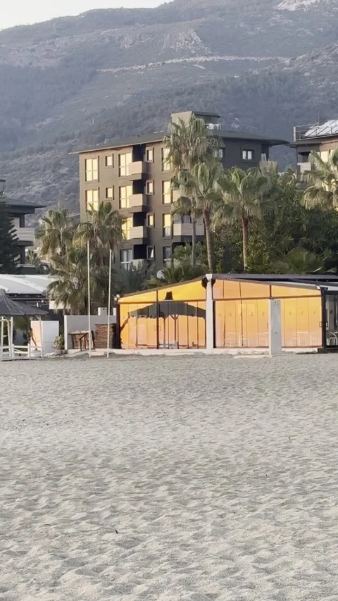 Reflection of the sun on the glass buildings of the beach Stock Footage 304763447