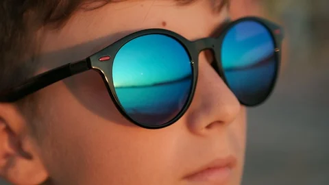 Reflection of the sun in glasses of sunglasses. School break. Tourism Stock-Footage 115202449