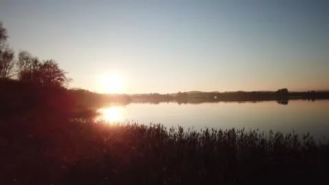 Reflection of the sun in the lake Stock Photos