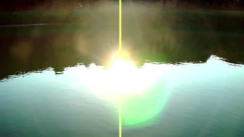 Reflection of the Sun on Lake Water Stock Footage 100228837
