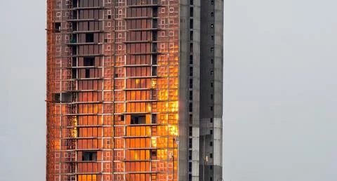 Reflection of Sun raise on multi stored building Stock Photos