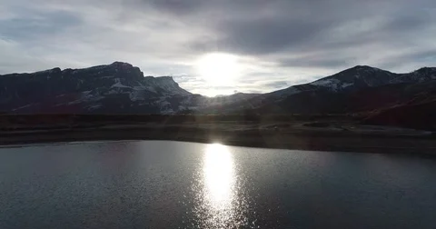 Reflection of the sun in the water of a mountain lake Video stock 85277682