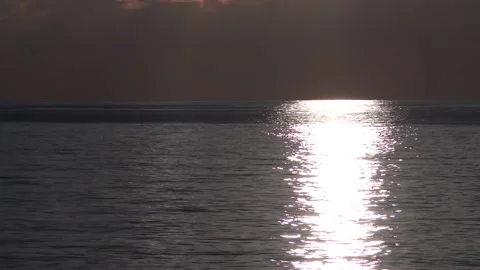 Reflection of the sun on a watery surface during sunset Stock Footage 94332019
