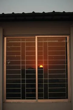 Reflection of the sun on the window glass Stock Photos