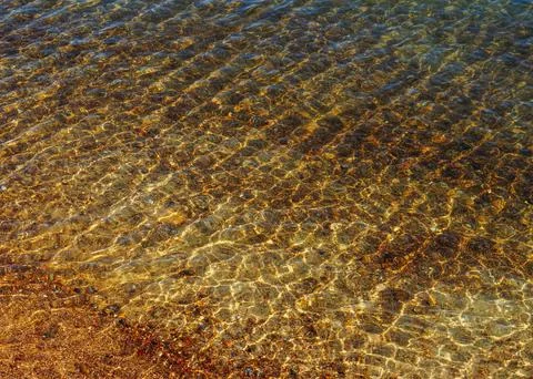 Reflection of sunlight and water surface shining on seabed. Stock Photos