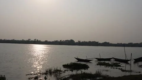 The reflection of sunlight on the flowing river Stock Footage 304060397