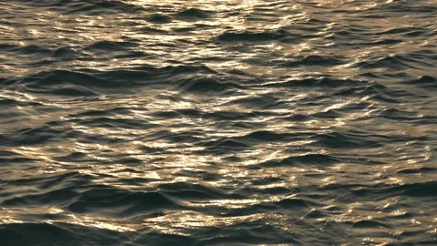 Reflection of sunlight over ocean surface. Beautiful sunset in the sea Stock Footage 174786139