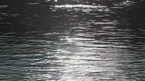 Reflection of the sunlight on the surface of a river. Close-up Stock Footage 46440343