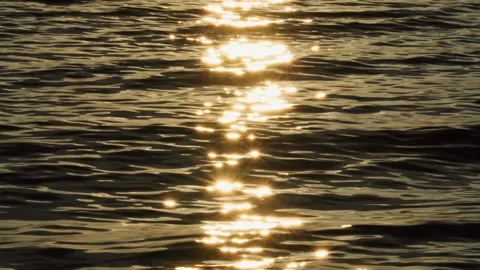 The reflection of sunlight on the surface of the sea at dusk at sunset. Stock Footage 274355088