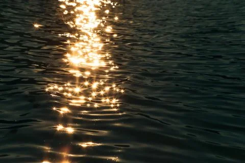 Reflection of sunlight in the water Stock Photos