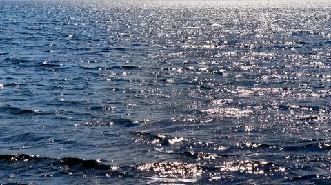 Reflection of sunlight on the water surface Stock Photos