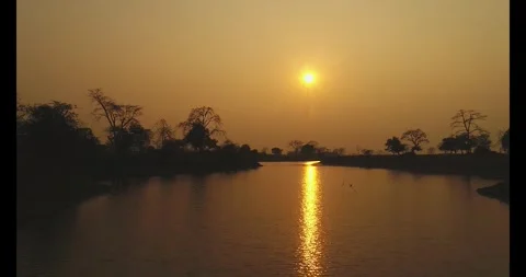 Reflection of sunlight on waterbody during sunset Kamrup Assam 4k file 82 Stock Footage 339268549