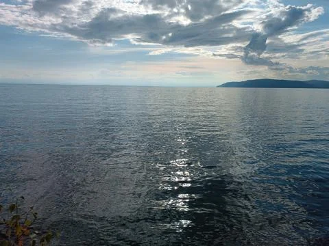 Reflection of the sun's rays in Lake Baikal Stock Photos