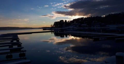 Reflection of the sunset in a calm sea Foto stock