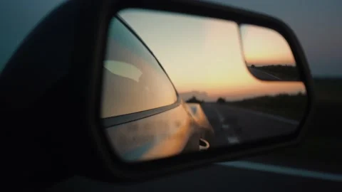 Reflection of the sunset in the car mirror Video stock 158239391