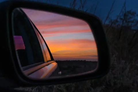 Reflection of the sunset in the car mirror Stock-Fotos