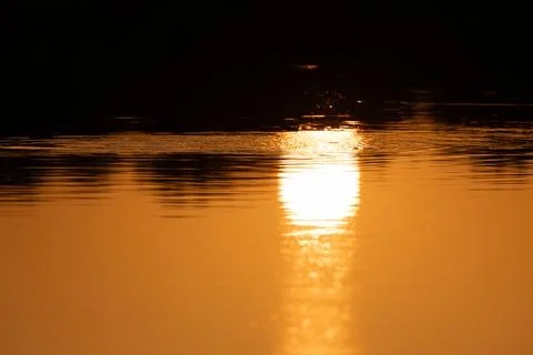 Reflection of sunset in the lake Stock Photos