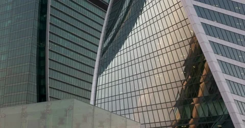 The reflection of the sunset in the mirrored Windows of the business center Video stock 66209632