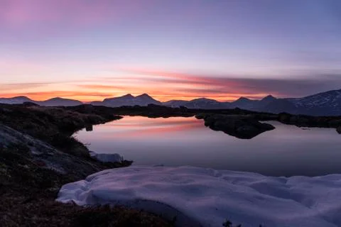 Reflection of a sunset on a small water Stock Photos