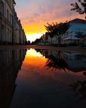 Reflection of sunset in the square Stock Photos
