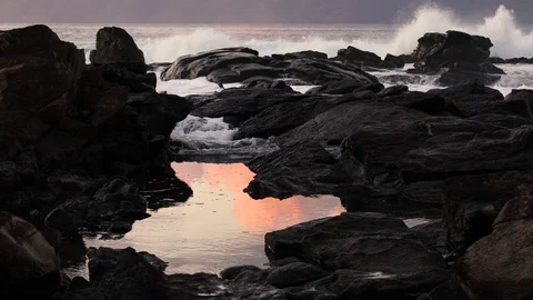 Reflection Of A Sunset In A Tide Pool With Crashing Waves 스톡 동영상 120480010