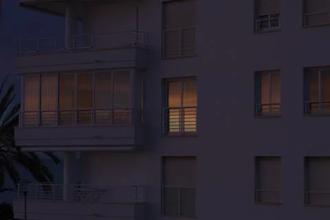 Reflection of the sunset in the windows of the house. Stock Photos