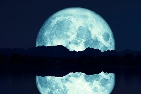 Reflection of super sturgeon moon on river night red sky back silhouette moun Stock Photos