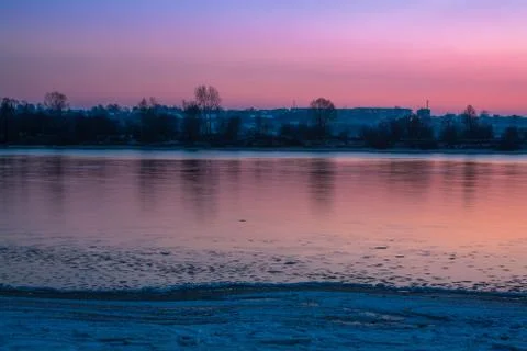 Reflection on the surface of the river at sunset at the beginning of winter,  Stock Photos