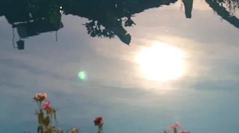 The reflection on the surface of the water, sun, house, trees Video stock 42110264