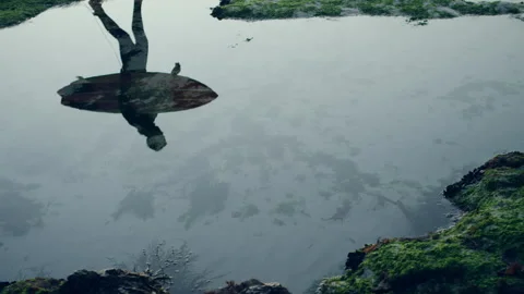 Reflection of a surfer in the water Stock Footage 278999655