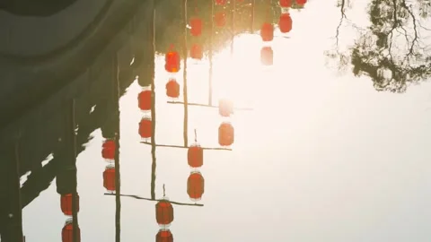 Reflection of Traditional Red Chinese Lanterns Floating on Calm Water Surface Stock Footage 342002858