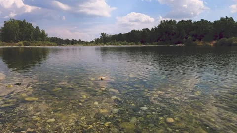 Reflection of trees and clouds in water Stock Footage 240254878