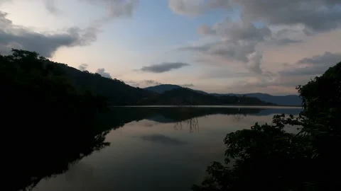 Reflection of trees and hills in the lake. Stock Footage 230078460