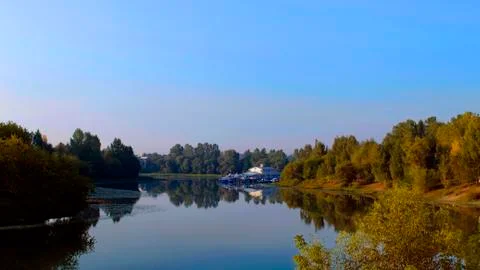 Reflection of trees in lake sunrise Stock Photos