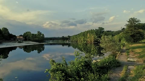 Reflection of trees at the river with bridge Stock Footage 223650940