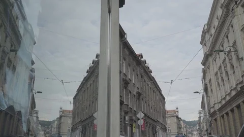 Reflection of A Trolley Bus &amp; Streets of Sarajevo, Bosnia, pan right-Slog2 Stock Footage 92694583