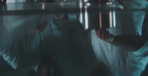 Reflection of two chefs mixing and stirring ingredients Stock Footage 204973095