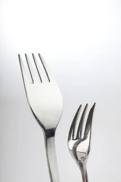 Reflection on two forks Stock Photos