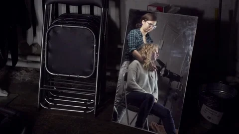 Reflection of two girls in a mirror during a photocall Stock Footage 71588133