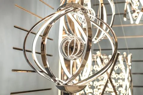 Reflection of an unknown person in a crystal decorative element of a hanging  Stock Photos