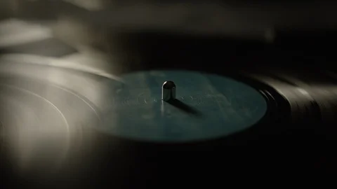 Reflection of vinyl record spinning on a turntable Stock Footage 129574311